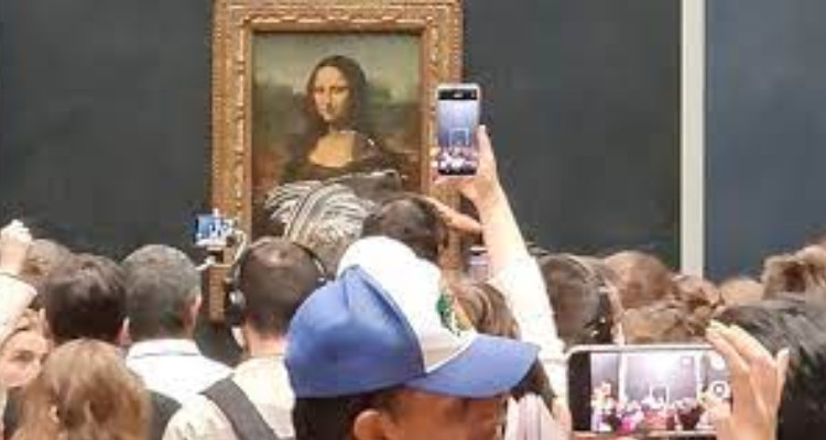 Eco-activist arrested after throwing cake at the Mona Lisa